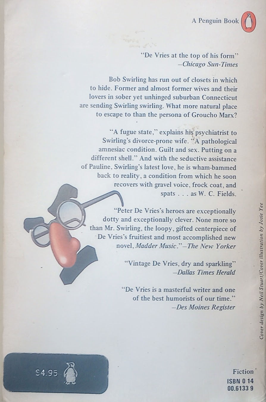 Book back cover of 'Madder Music' with praise for the book and a cartoon character joke mask.