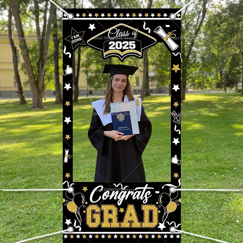 Graduation-themed photo frame with 'Class of 2025' and 'Congrats GRAD' text, used to take a photo of a person in graduation attire outdoors.