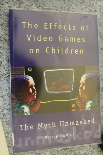Book cover of 'The Effects of Video Games on Children: The Myth Unmasked' by Barrie Gunter on a textured surface.