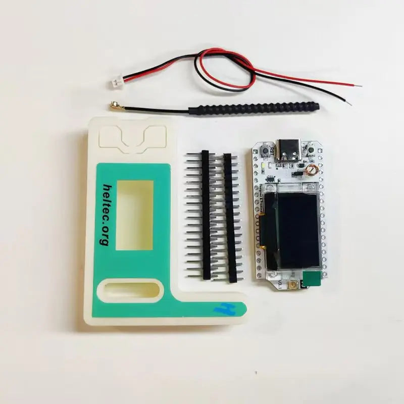 Complete Heltec LoRa 32 V3 kit including board, LoRa antenna, battery connector, and header pins.