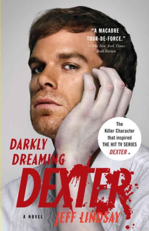 This image features the cover of the novel "Darkly Dreaming Dexter" by Jeff Lindsay. The cover is designed with a close-up of the main character, Dexter Morgan, played by Michael C.