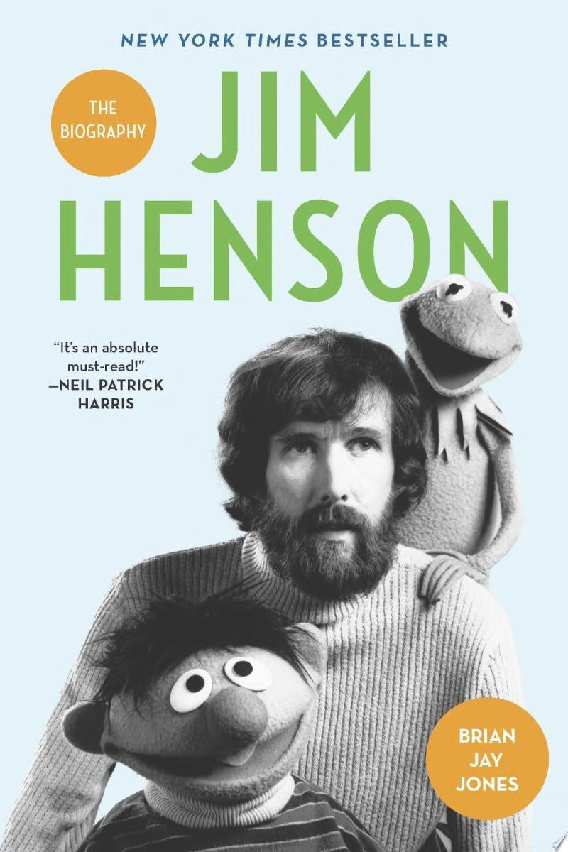Book cover of 'Jim Henson: The Biography' with a photo of Jim Henson and two Muppets against a light blue background.