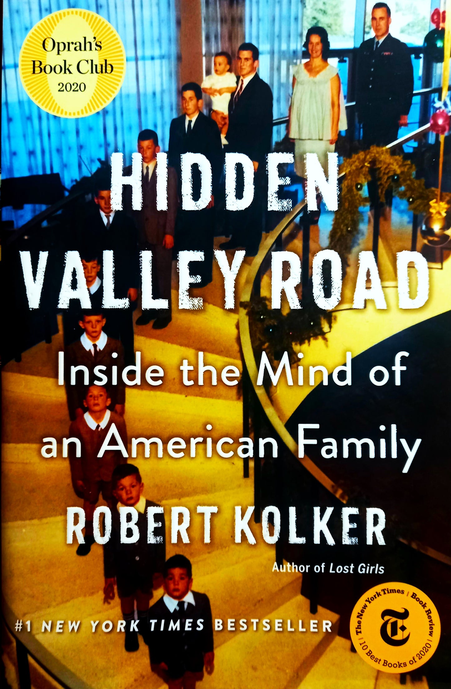 Book cover of 'Hidden Valley Road: Inside the Mind of an American Family' by Robert Kolker featuring a black and white photo of a family with multiple generations.