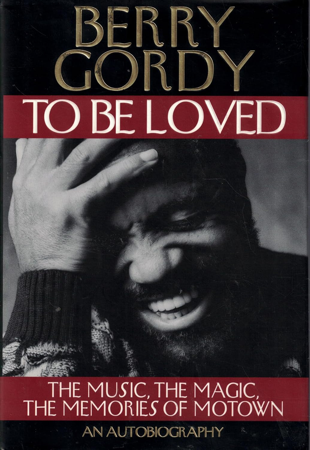 Front cover of 'To Be Loved: The Music, Magic & Memories of Motown' by Berry Gordy, featuring a photo of Berry Gordy Smiling and laughing happily and his hand over his forehead.