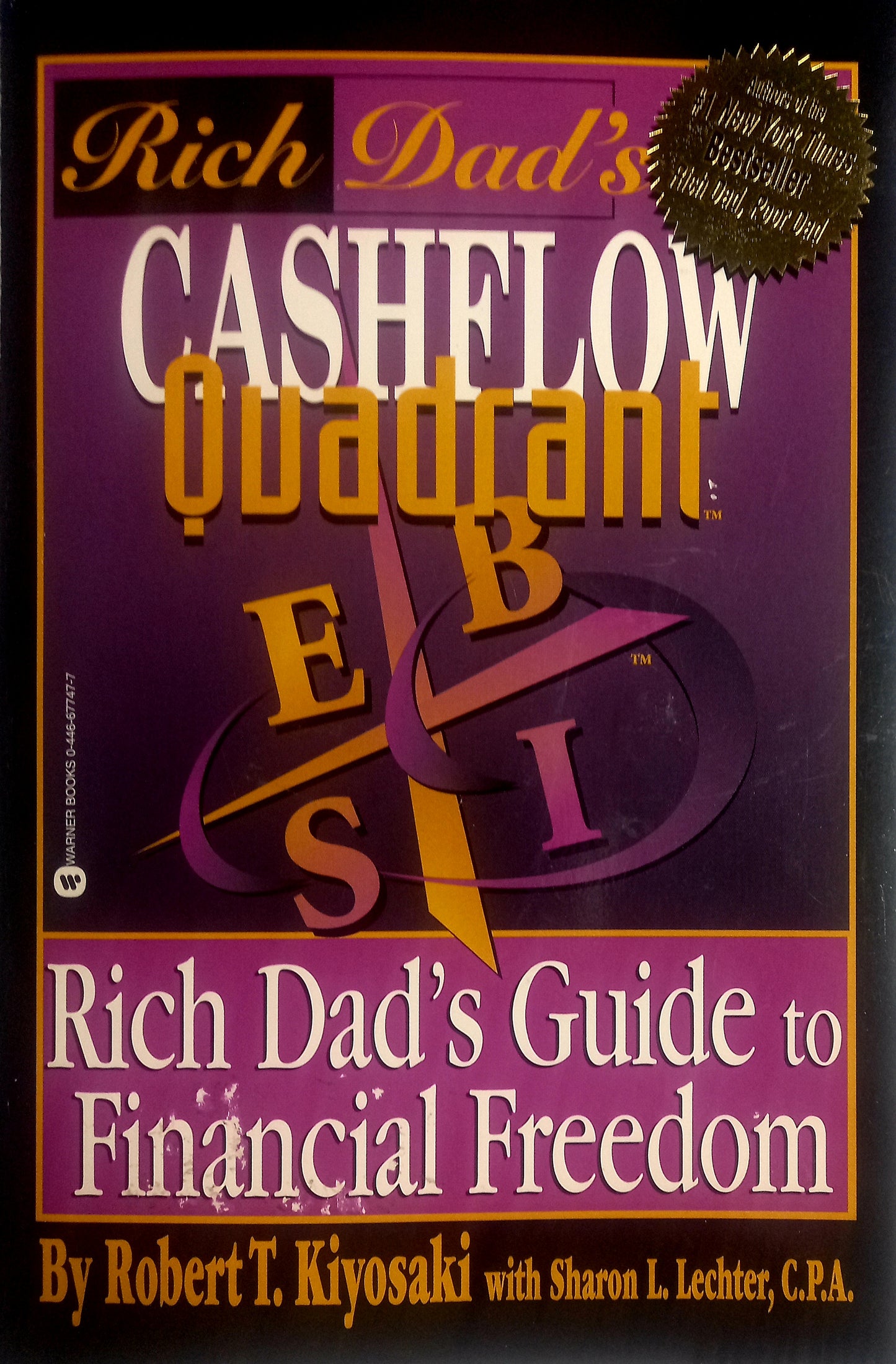 Book cover of 'Rich Dad's Cashflow Quadrant' by Robert T. Kiyosaki with a purple and yellow design.