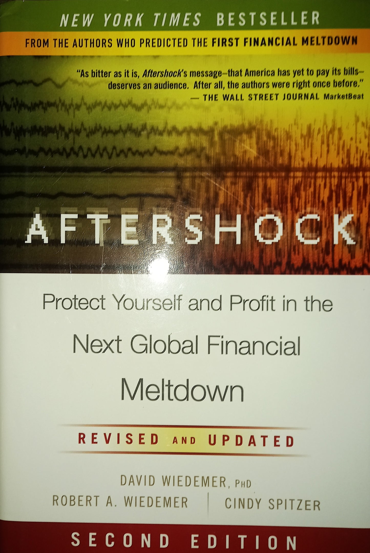 Book cover of 'Aftershock' with text about financial advice on a multicolored background