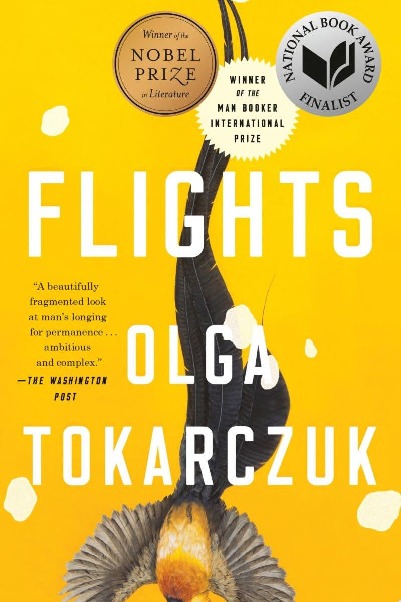 Book cover for 'Flights' by Olga Tokarczuk, featuring a bright yellow background with large white title text, a black bird silhouette, and award seals at the top.
