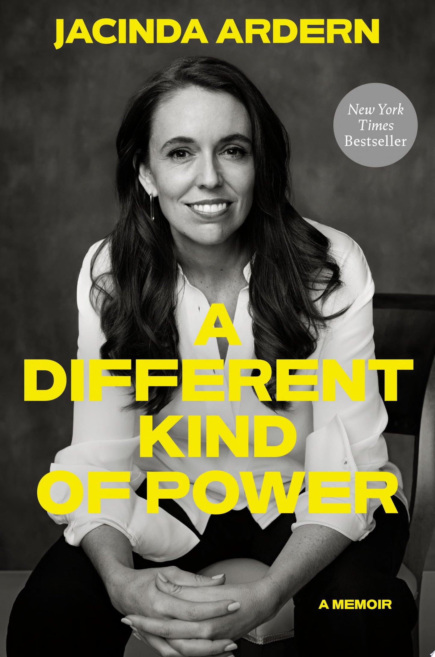Book cover for 'A Different Kind of Power' by Jacinda Ardern, featuring a black-and-white portrait of the author with large yellow title text and a gray 'New York Times Bestseller' badge.