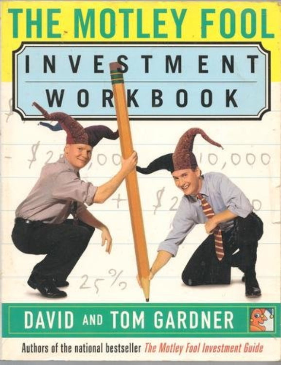 The cover of the book 'The Motley Fool Investment Workbook' by David and Tom Gardner, featuring two people with stylized hats holding a large pencil, with financial-related graphics in the background.