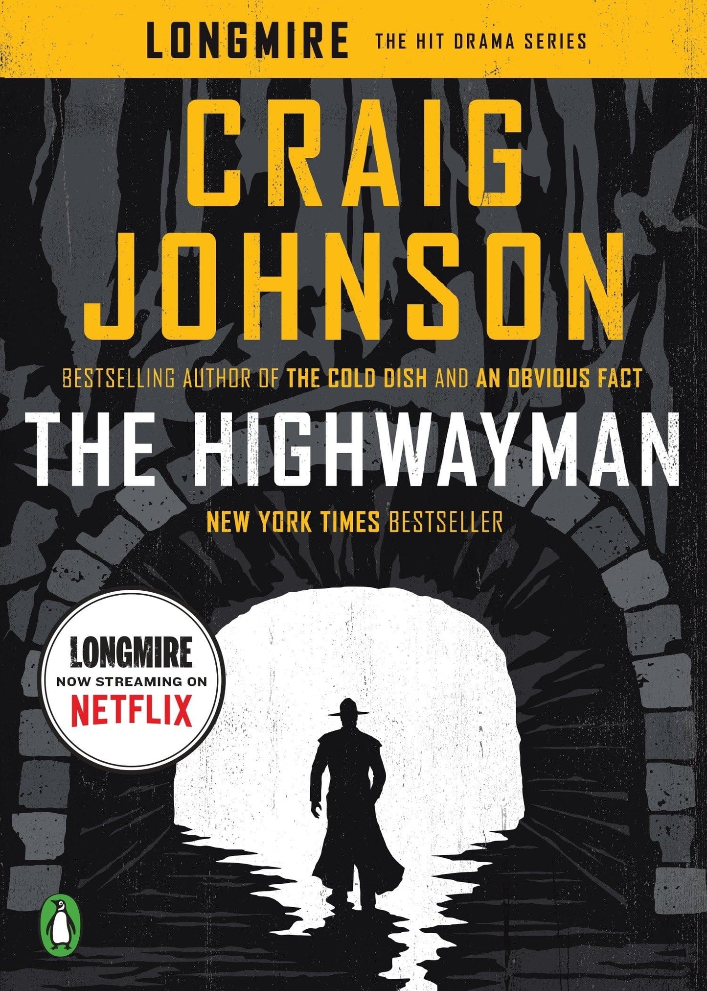 Book cover of 'The Highwayman' by Craig Johnson with a silhouette of a man in a hat walking through an archway.