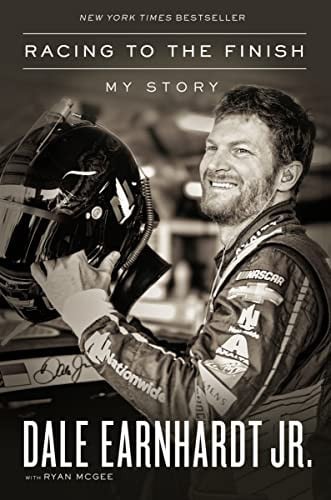 Book cover of 'Racing to the Finish' by Dale Earnhardt Jr., featuring a black and white photo of the author holding a helmet.