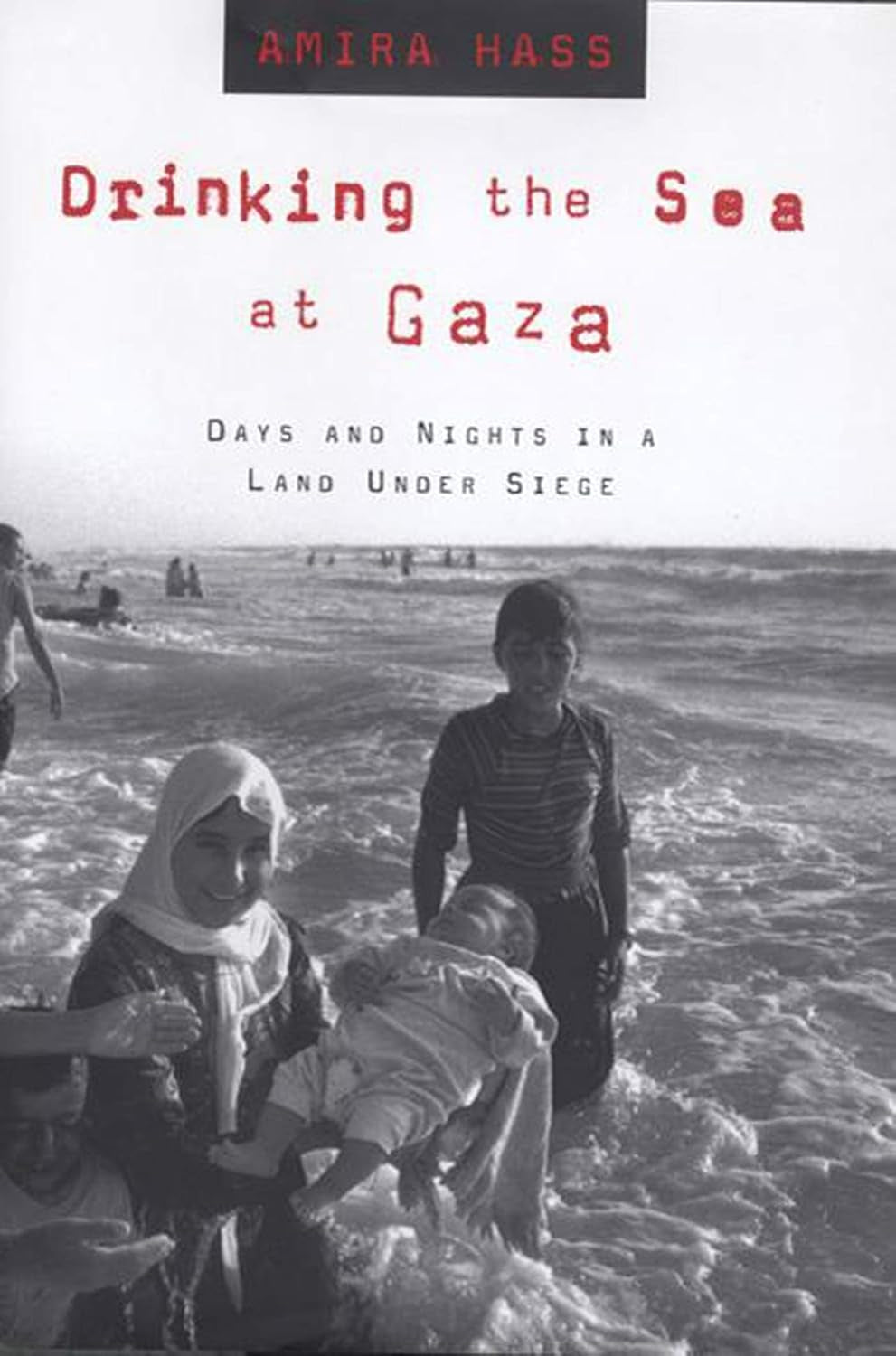 The cover of the book 'Drinking the Sea at Gaza' shows a black and white photograph of two women and a child on a beach, with the title and author's name at the top.