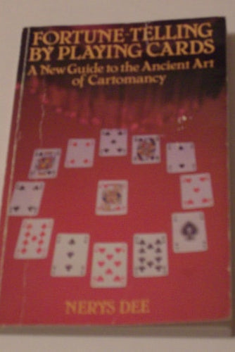 Book titled 'Fortune-Telling by Playing Cards' by Nerys Dee on a beige background