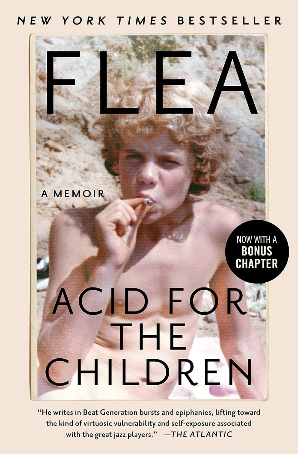 Book cover of 'Acid for the Children: A Memoir' by Flea featuring a photograph of the author as a young man, with a background that includes a sandy beach and hills.