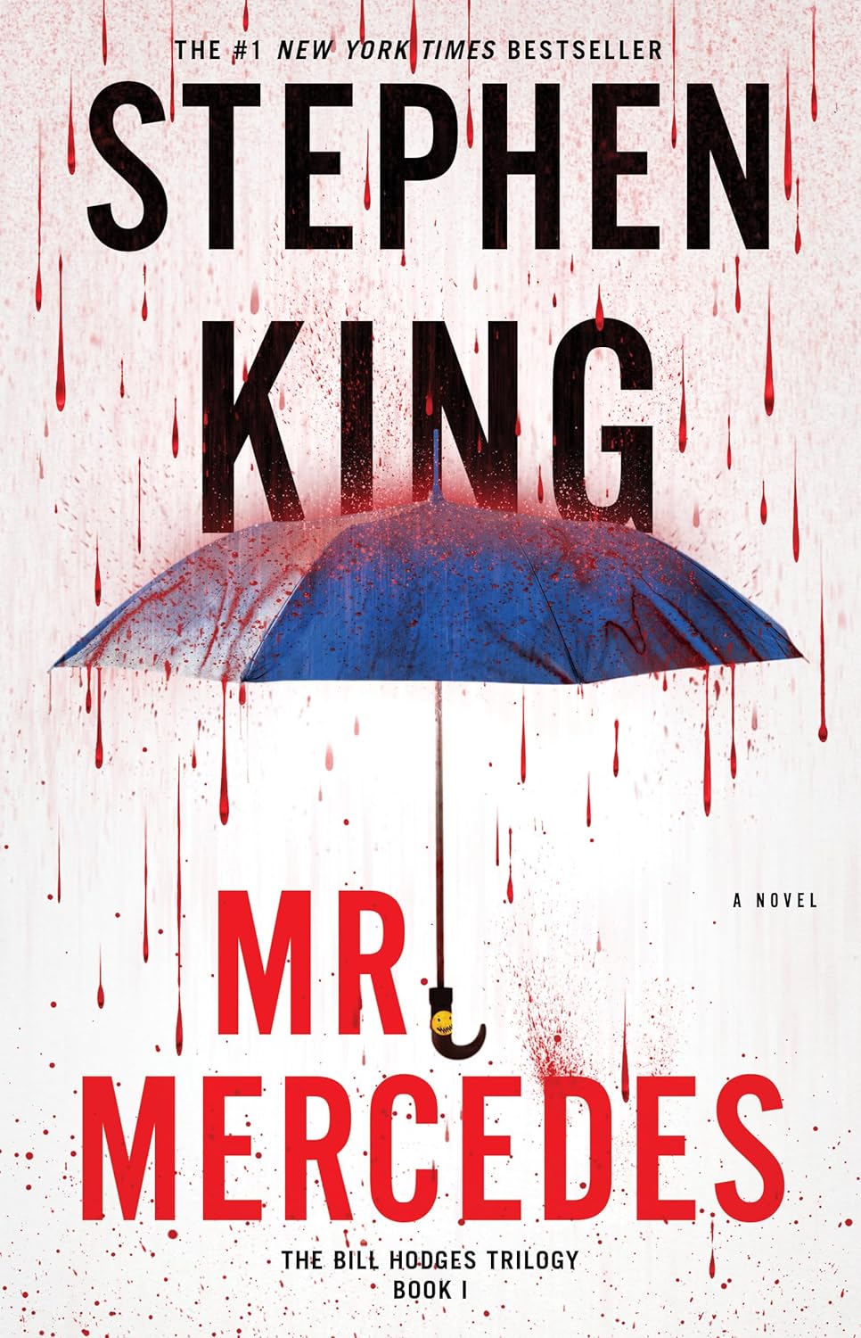 Book cover of 'Mr. Mercedes' by Stephen King with a blue umbrella and red text on a white background.