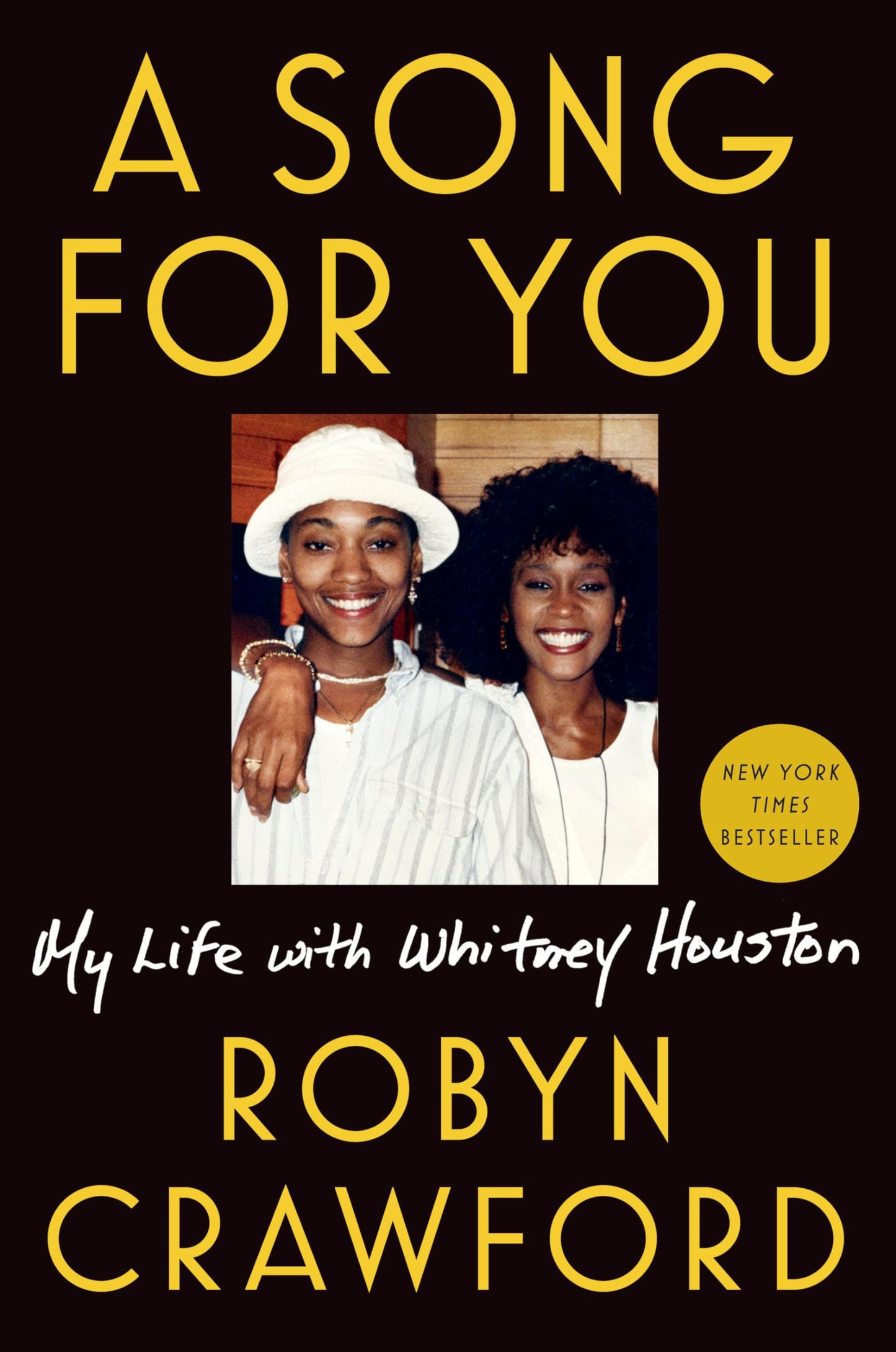 Book cover of 'A Song for You: My Life with Whitney Houston' by Robyn Crawford with a photo of two women on a black background.