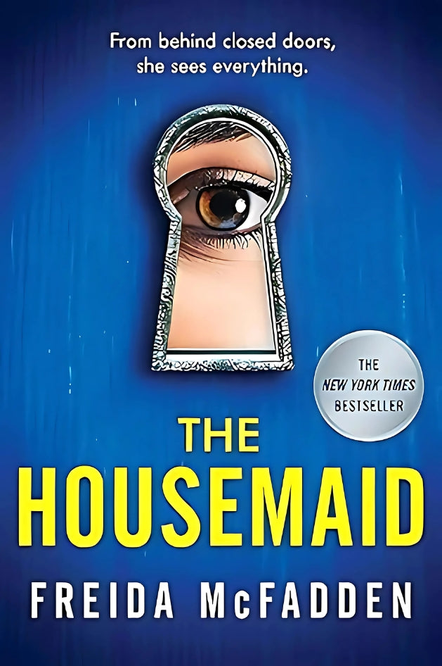 The cover of the book 'The Housemaid' by Freida McFadden, featuring a blue background with a keyhole and an eye looking through it, text highlighting it as a New York Times bestseller.