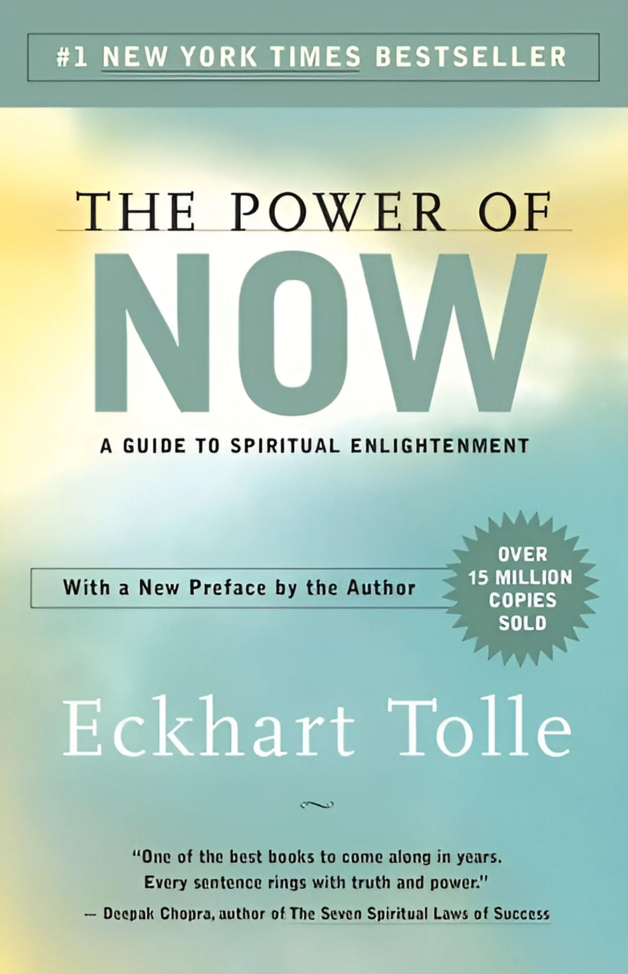 This image features the cover of "The Power of Now" by Eckhart Tolle, a guide to spiritual enlightenment. The cover design is minimalist, with a plain white background that highlights the title and author's name prominently displayed in bold, black lettering.