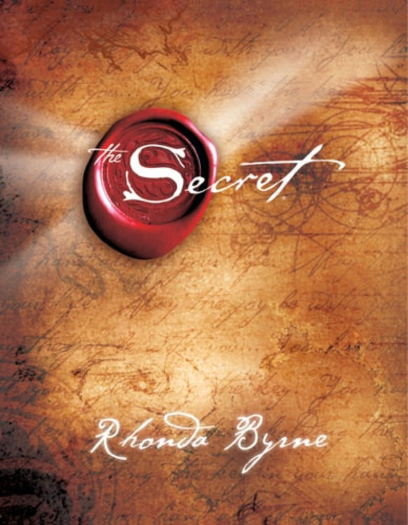 Cover of the book 'The Secret' by Rhonda Byrne, featuring a red wax seal stamp with the title written in white script on a textured, vintage-style background.