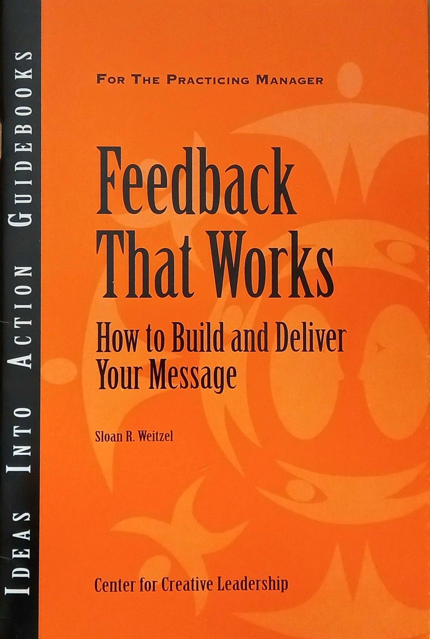 Book cover of 'Feedback That Works' by Sloan R. Weitzel with an orange background and black text.