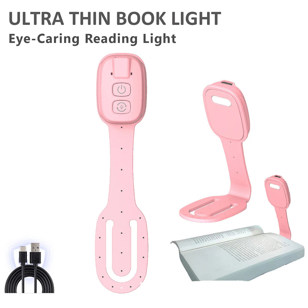 Pink ultra thin book light with USB cable on a white background