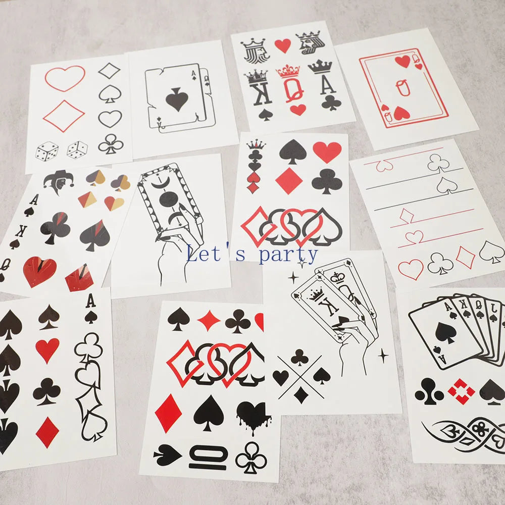 Collection of playing card symbol fake tattoos on white paper.