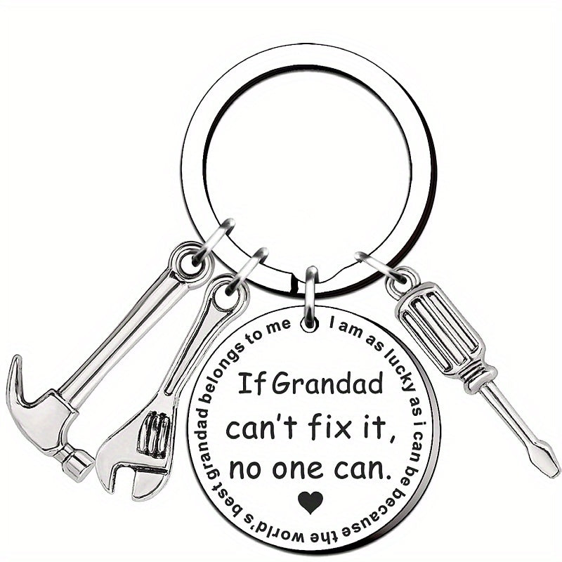 Keychain with tools and engraved message on a white background