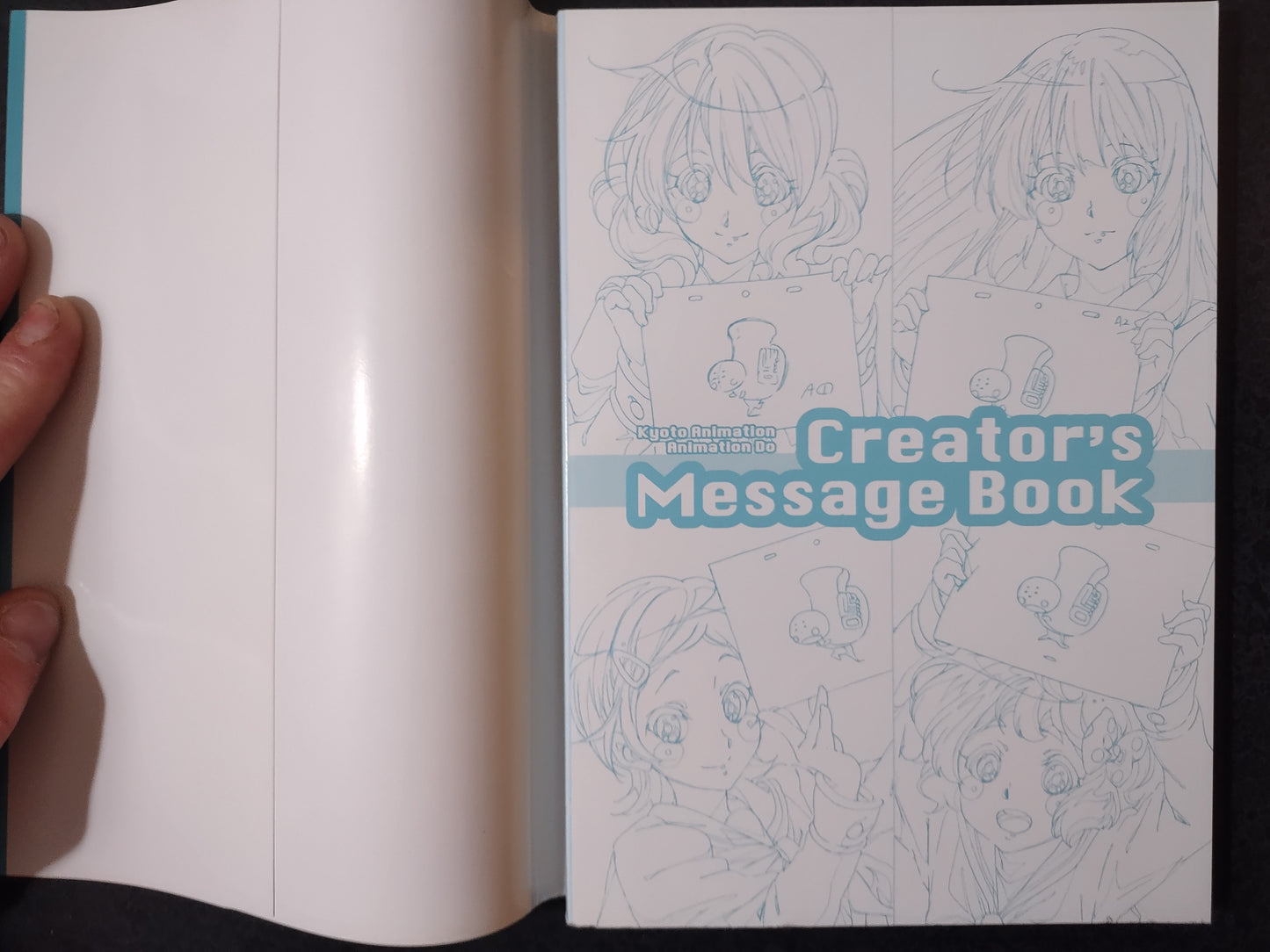Open book with illustrations and 'Creator's Message Book' text