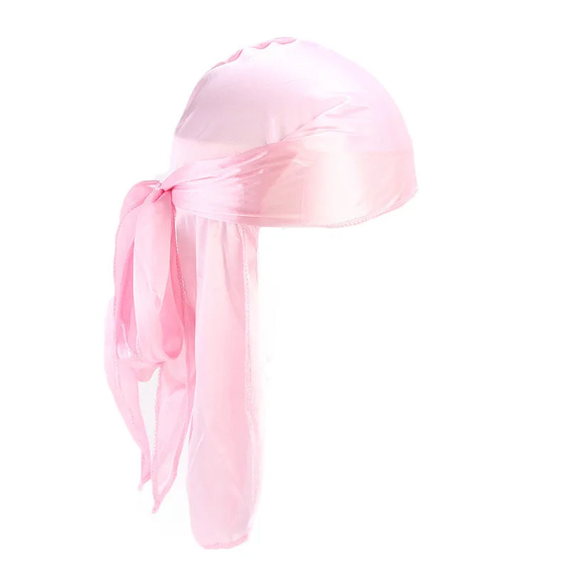 Pink satin headscarf with a long ribbon on a white background
