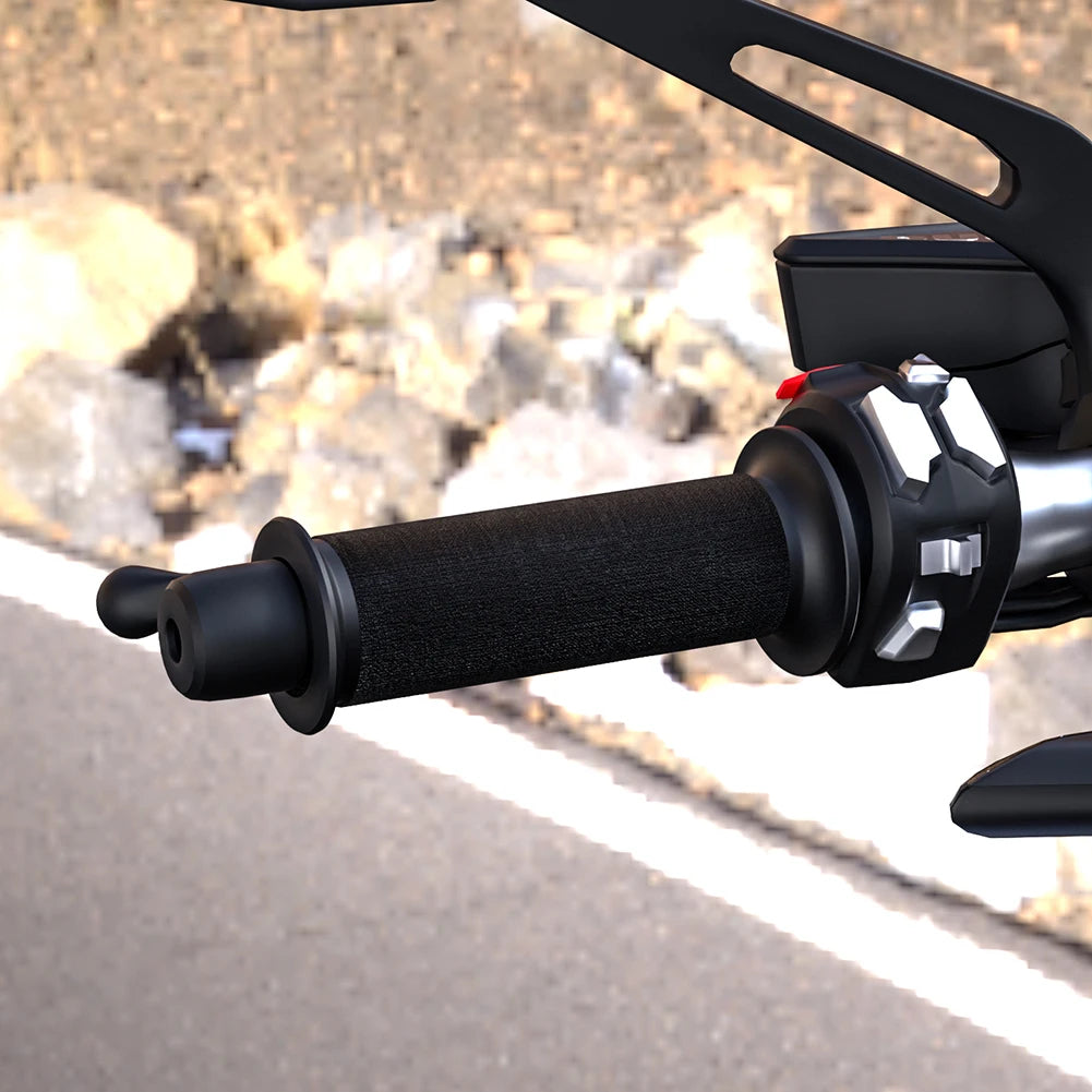 Close-up of motorcycle handlebar with A hand warming handlebar wrap and blurred road in the background