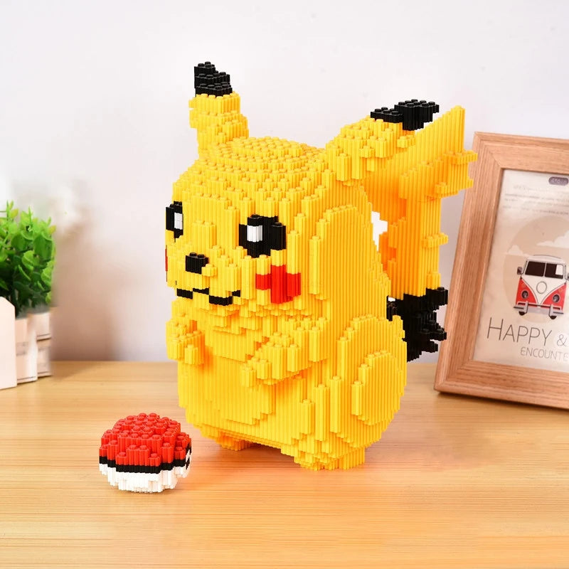 Yellow Pikachu figure made of interlocking bricks on a wooden surface with a plant and photo frame in the background.