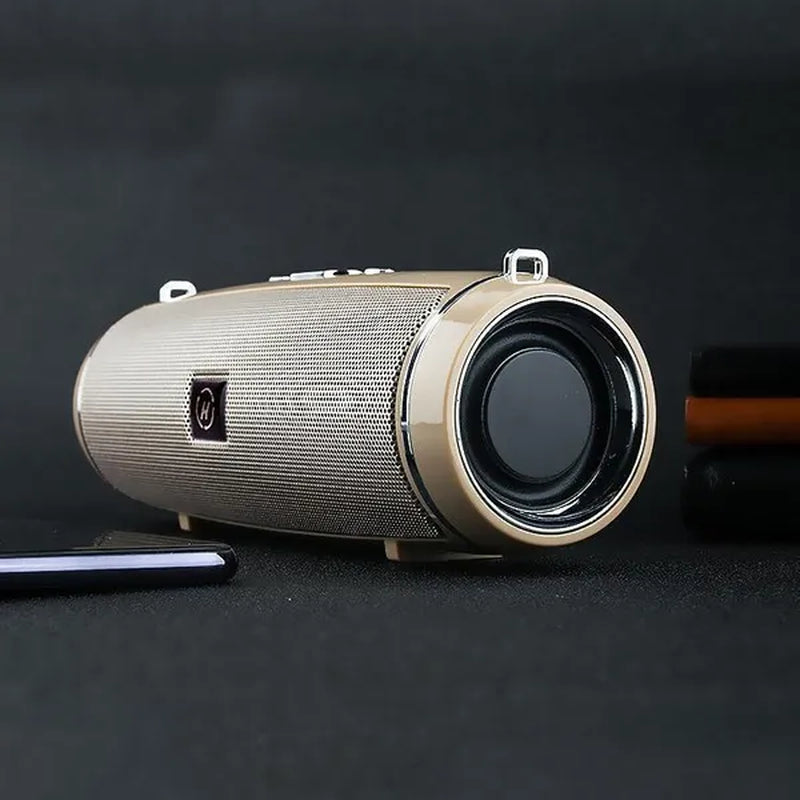 A gold waterproof portable speaker advertised with various features such as Bluetooth 5.1 connectivity, 360-degree surround sound, and a double horn for enhanced bass.