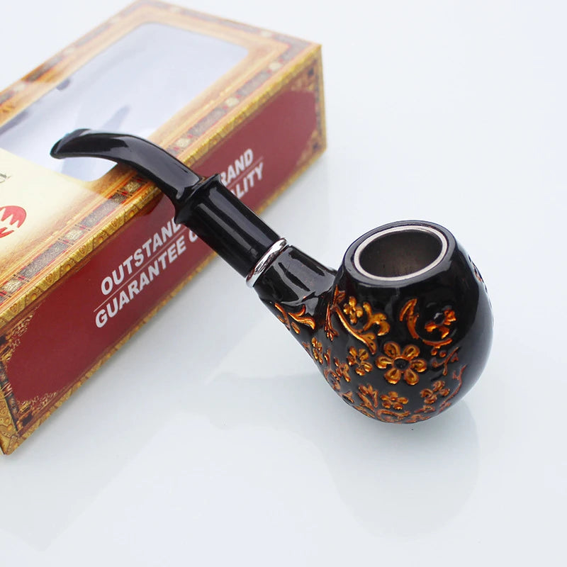Decorative smoking pipe with floral patterns on a white background