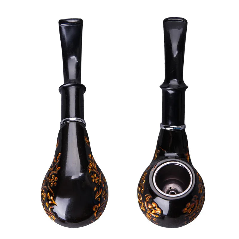 Two black glass pipes with decorative patterns on a white background