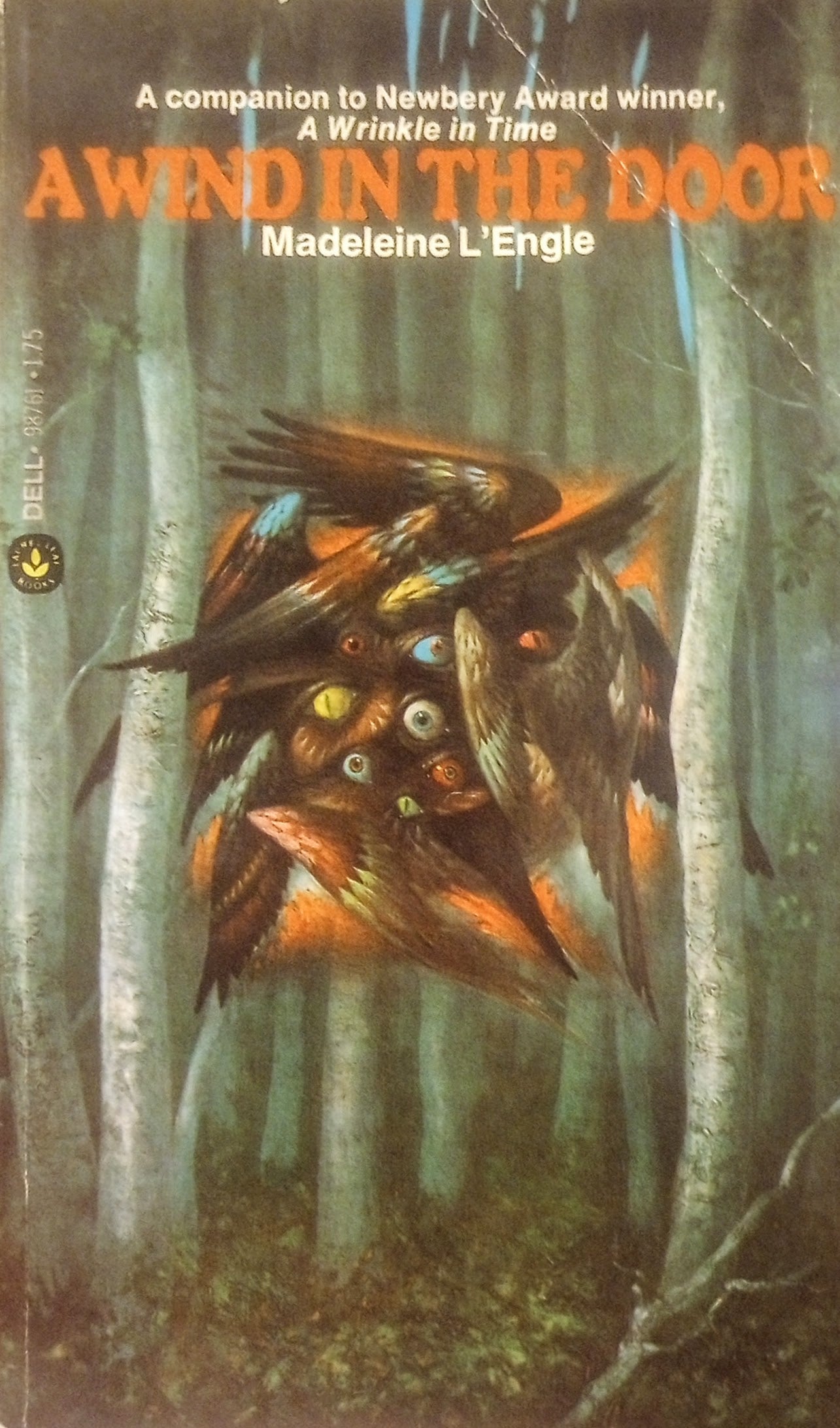 Book cover of 'A Wind in the Door' by Madeleine L'Engle with a bird and forest design.