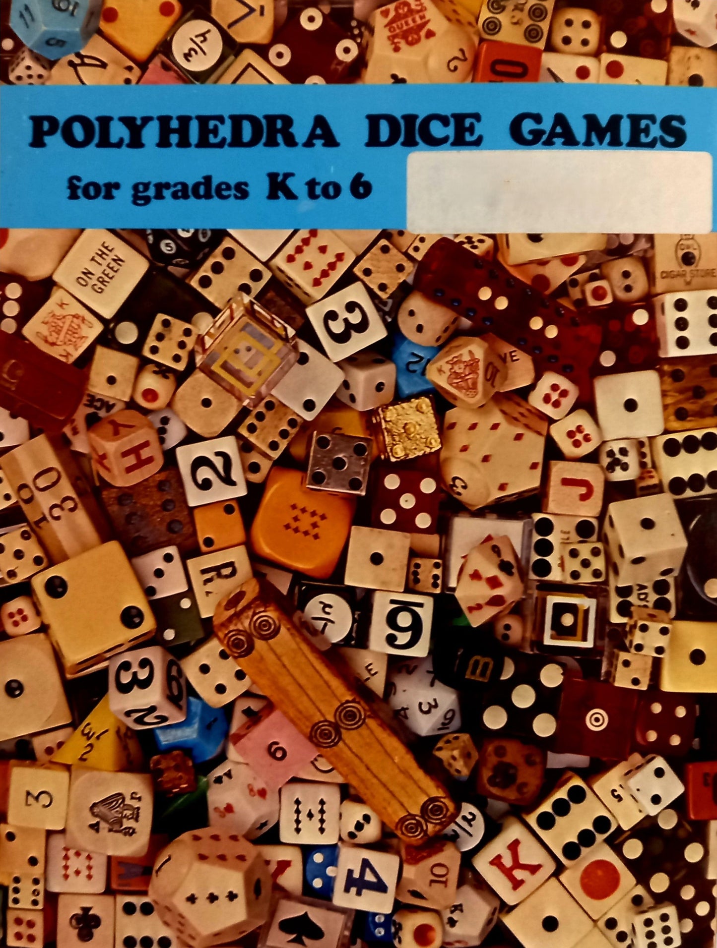 Book cover of Polyhedra dice games for grades K to 6 with a variety of dice on a blue background.
