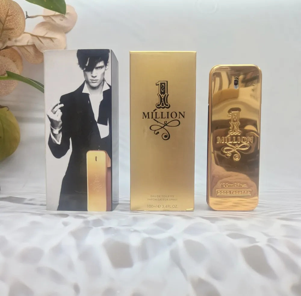 Gold '1 Million' perfume bottle and packaging on a textured surface with a blurred background
