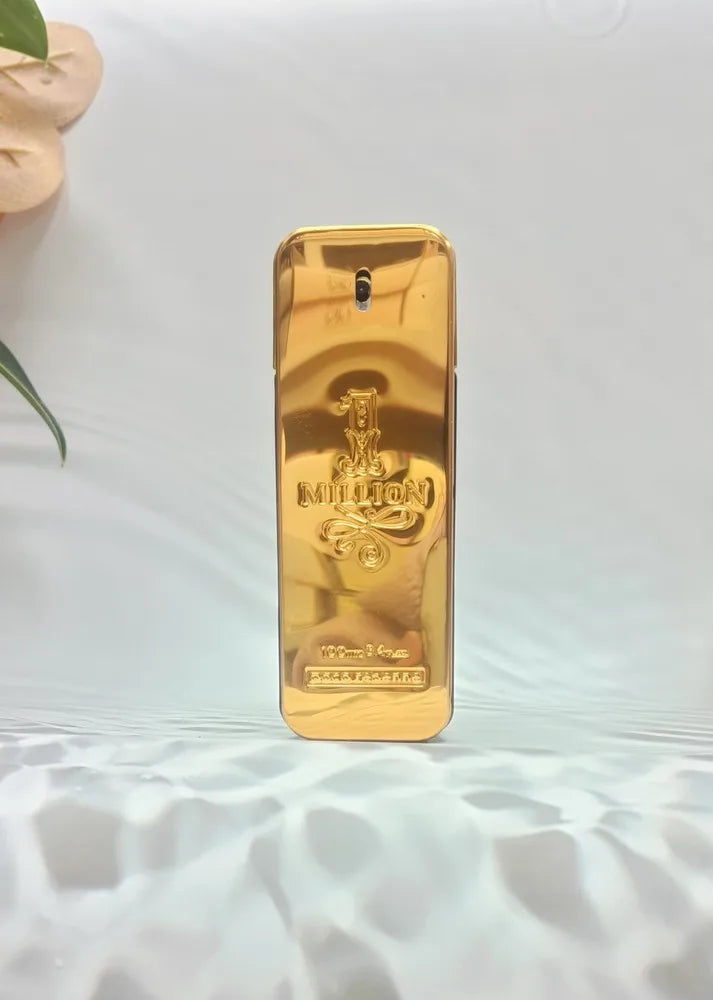Gold-colored perfume bottle with brand logo on a white surface