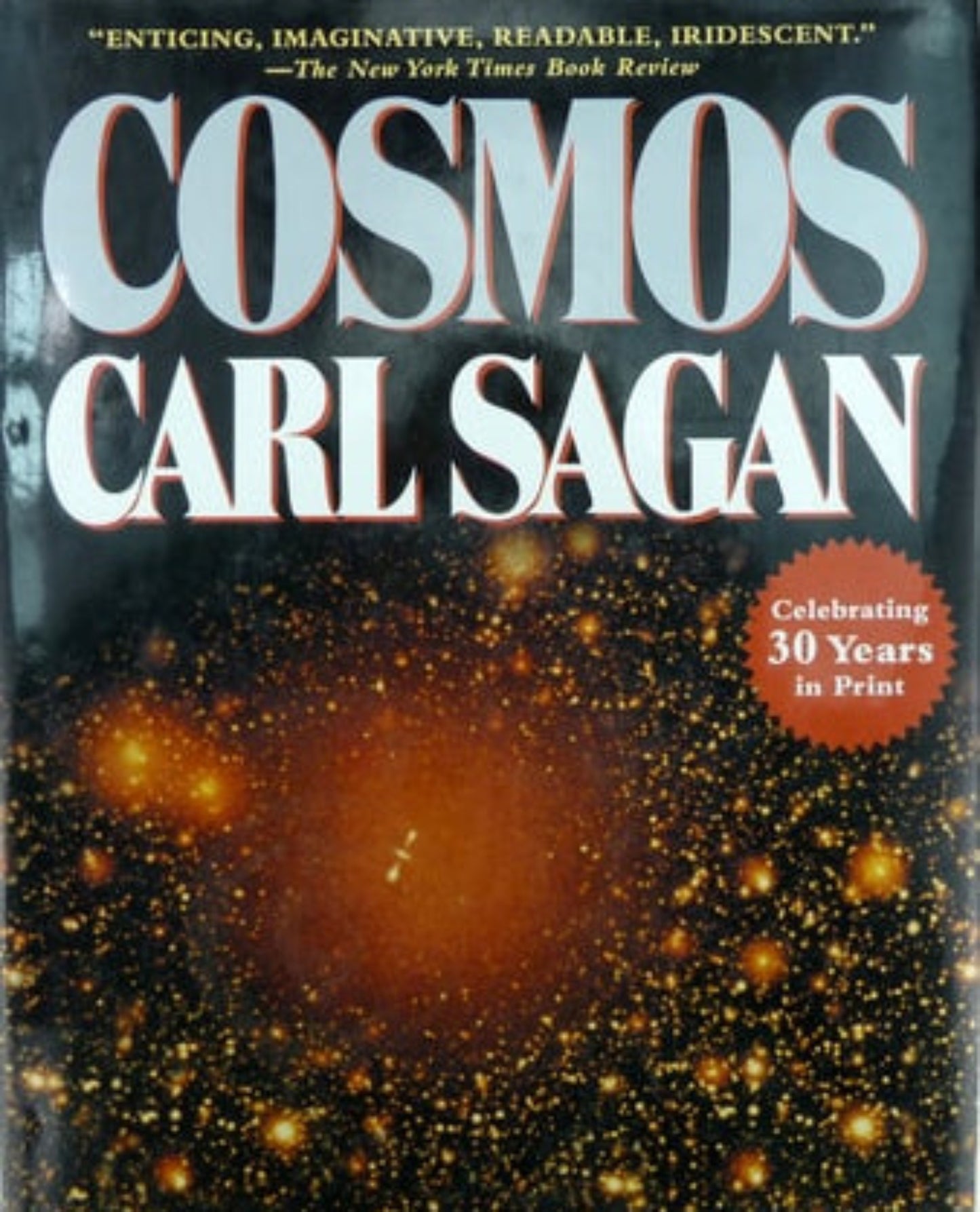 Book cover of 'Cosmos' by Carl Sagan with celestial image on a light blue background