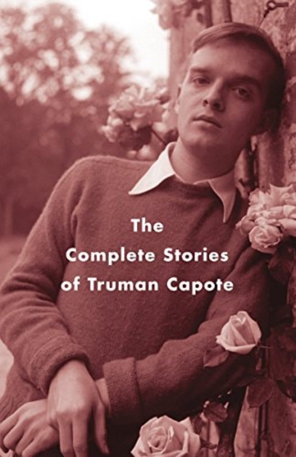 Book cover of 'The Complete Stories of Truman Capote' with a sepia-toned image of a man holding flowers.