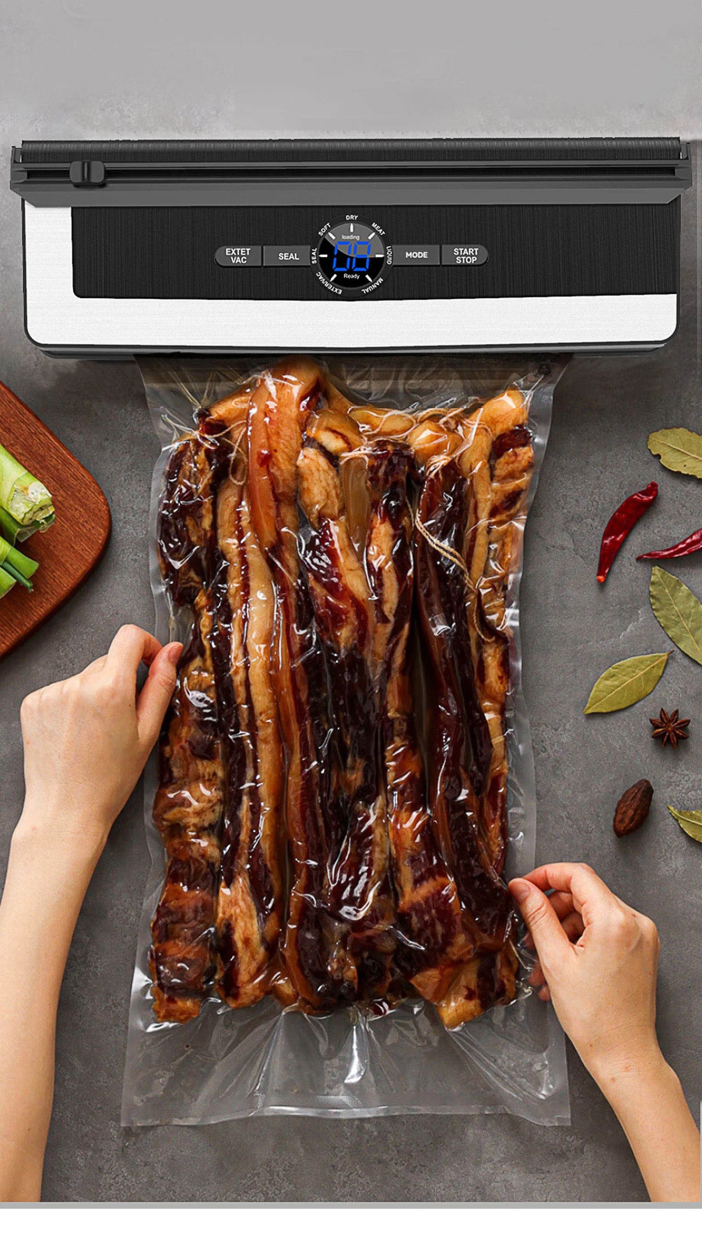 Person using a vacuum sealer to seal a package of food on a gray surface.