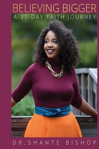 Book cover of 'Believing Bigger' by Dr. Shante Bishop with a woman standing outdoors.