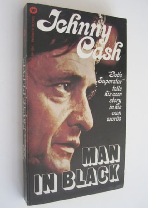 Book cover of 'Man in Black' by Johnny Cash with a portrait on a white background