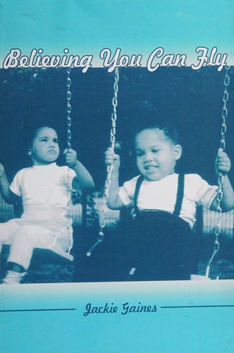 Black and white photo of two children on swings with text 'Believing You Can Fly' and 'Jackie Gaines'.