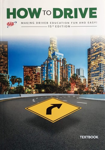 Textbook cover titled 'How to Drive' with a cityscape and road sign on the cover.