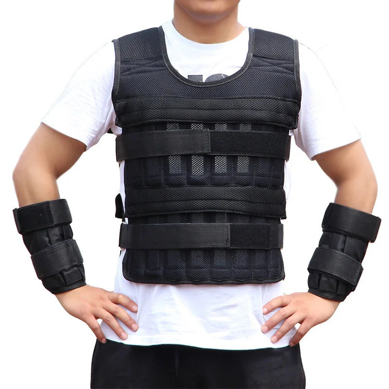 Person wearing a black weighted vest and arm sleeves on a white background