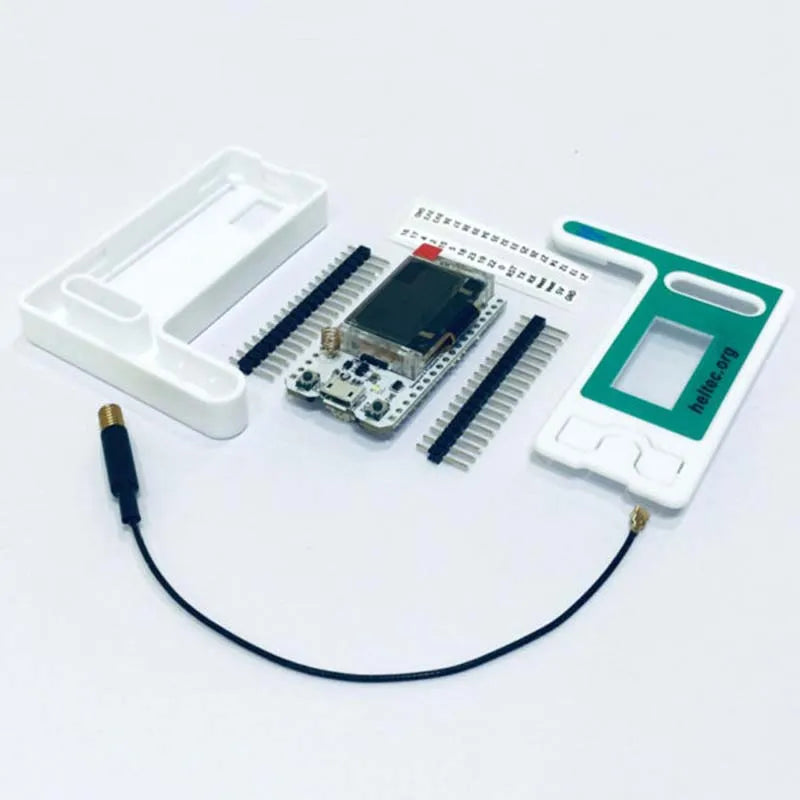 Electronic components including a microcontroller development board, connectors, and cables on a white background