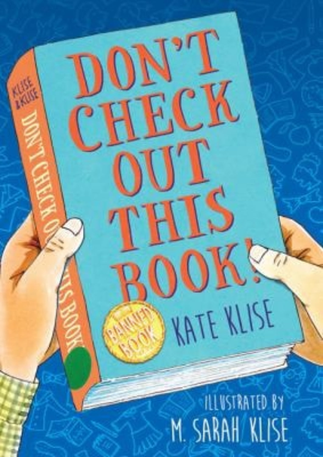 Book titled 'Don't Check Out This Book!' held by hands against a blue background