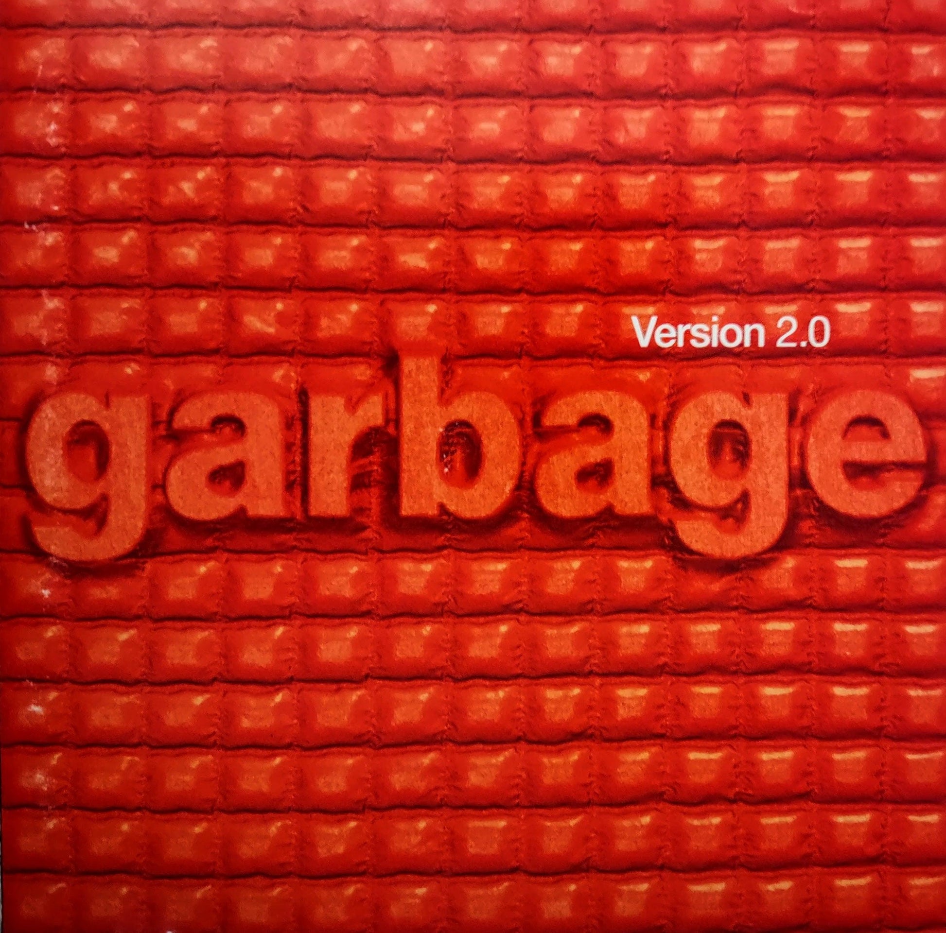 Album cover with 'garbage' and 'Version 2.0' text on a textured red background
