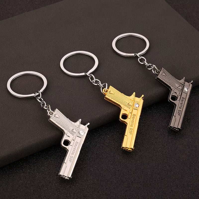 Keychains Bust Baby Beretta Handgun Keychain by Pistol Products & Cool Keychains ...